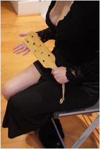 Egyptian domme in London with spanking paddle