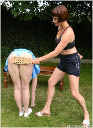 Cheerleader touches her toes for strict discipline